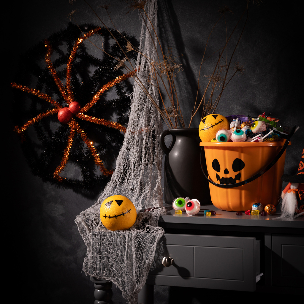 Halloweenská dekorace PAVUČINA černo-oranžová 50 cm