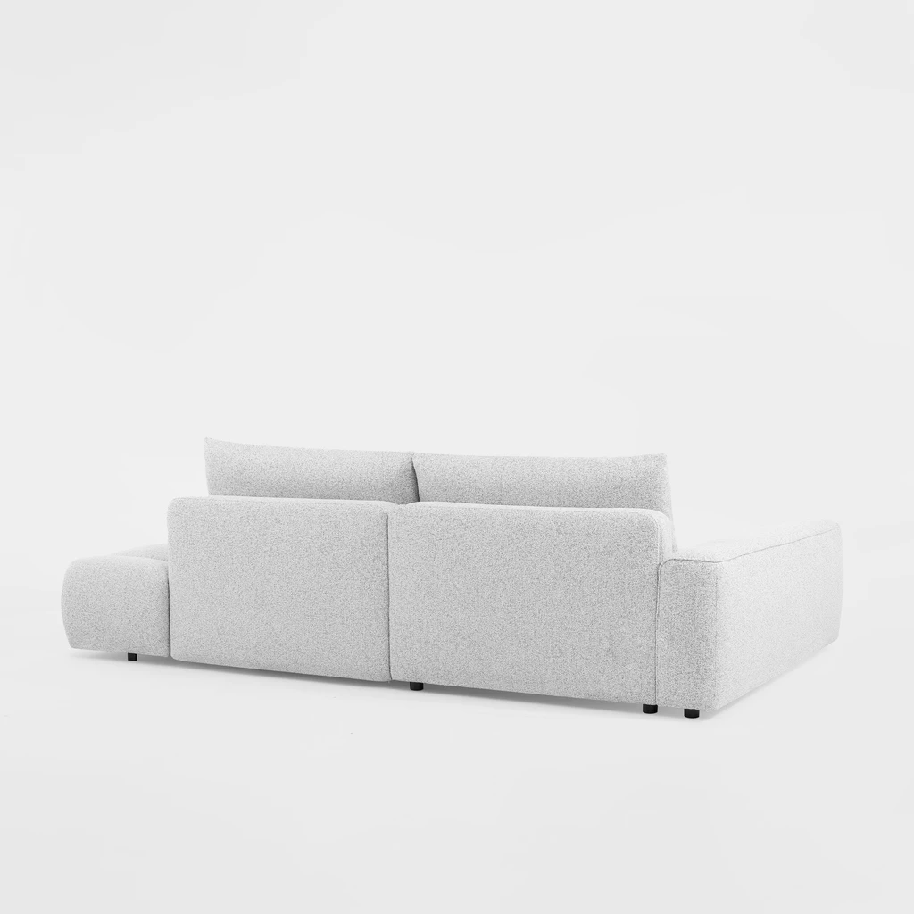 Pojemnik na pościel w narożniku BIANCO O ułatwia przechowywanie koców i poduszek.