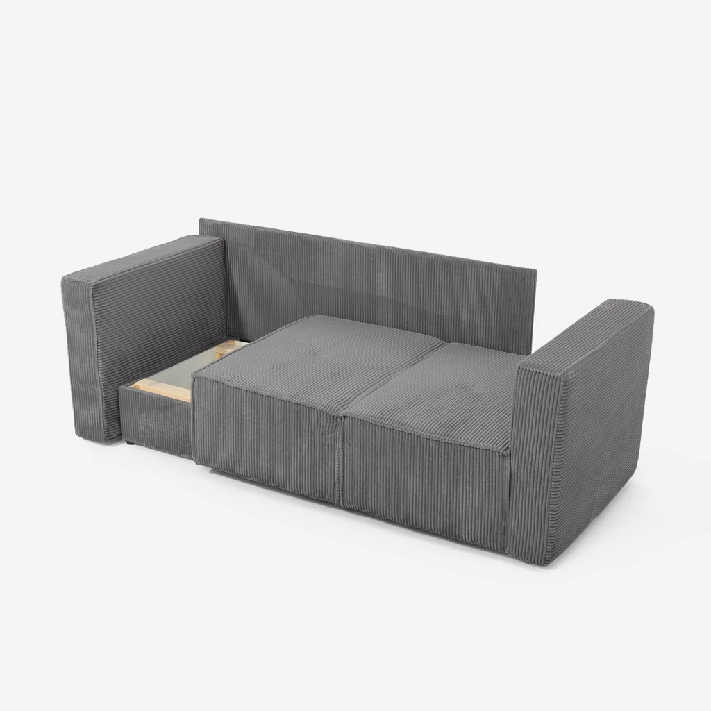 Szara sofa LUSO otula miękkością i zaprasza, by zatrzymać się na moment w rytmie codzienności.