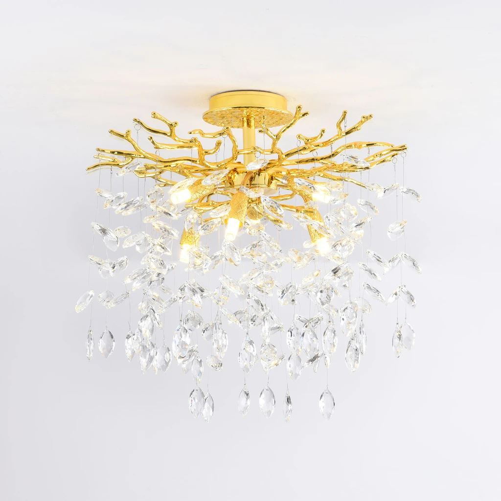 Design pięknie zdobionego stelaża lampy CINDY uzupełniają akrylowe kryształki.