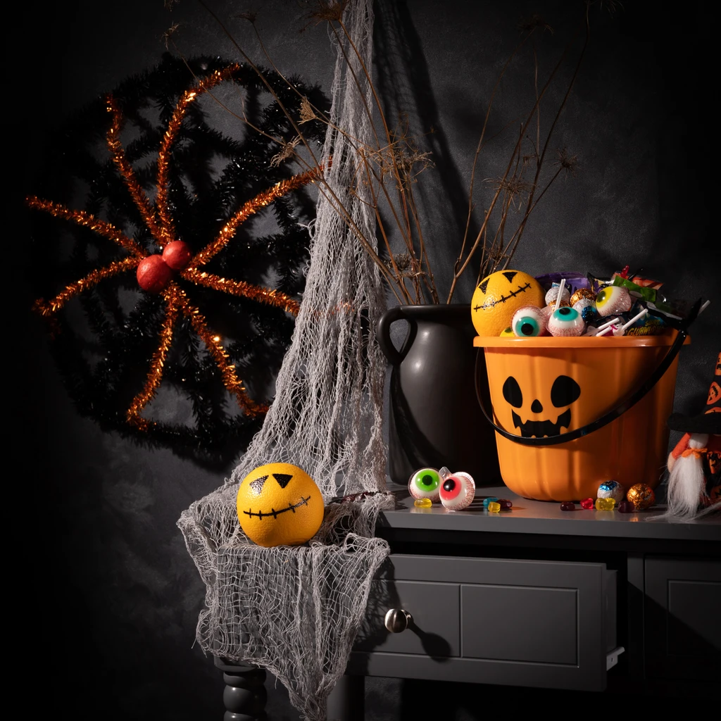 Halloweenská dekorace PAVUČINA černo-oranžová 50 cm