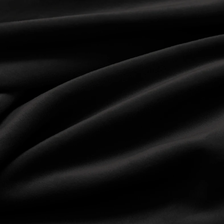 Zdjęcie pokrowca. Duże zbliżenie. Widać marszczenia i fakturę materiału.