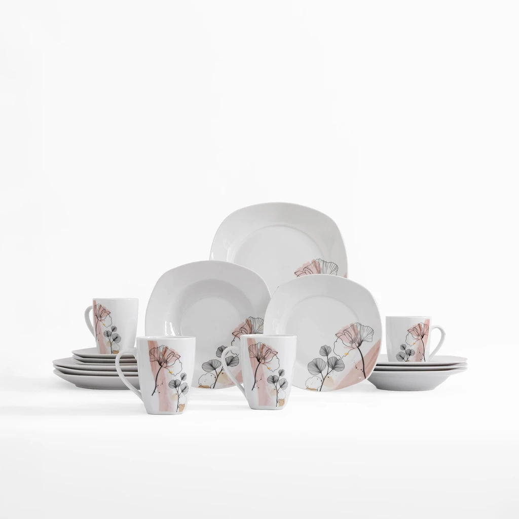 Zestaw porcelany o beżowych i jasnoróżowych plamach oraz z motywem liści miłorzębu zaznaczonych czarnym, lekkim konturem.