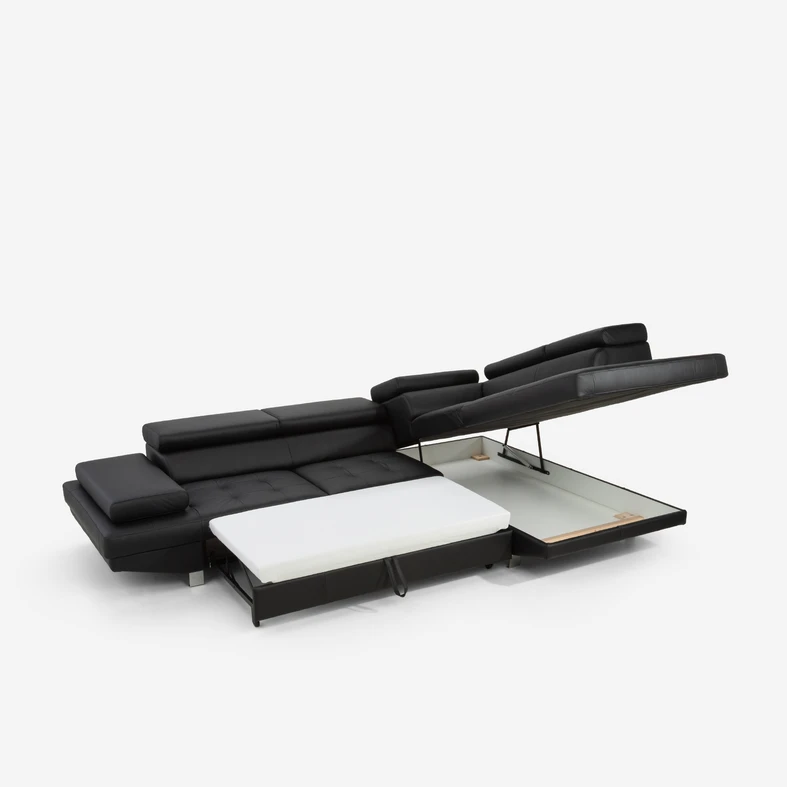 Rozłożona funkcja spania okazjonalnego i podniesiony pojemnik w otomanie.