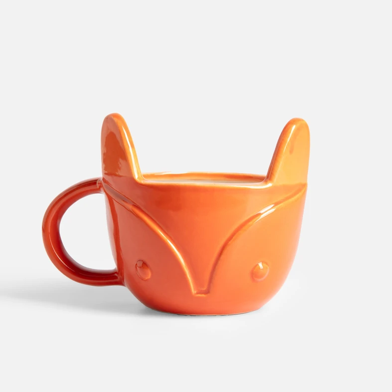 Pomarańczowy ceramiczny kubek w kształcie głowy lisa z uszami i uchwytem.