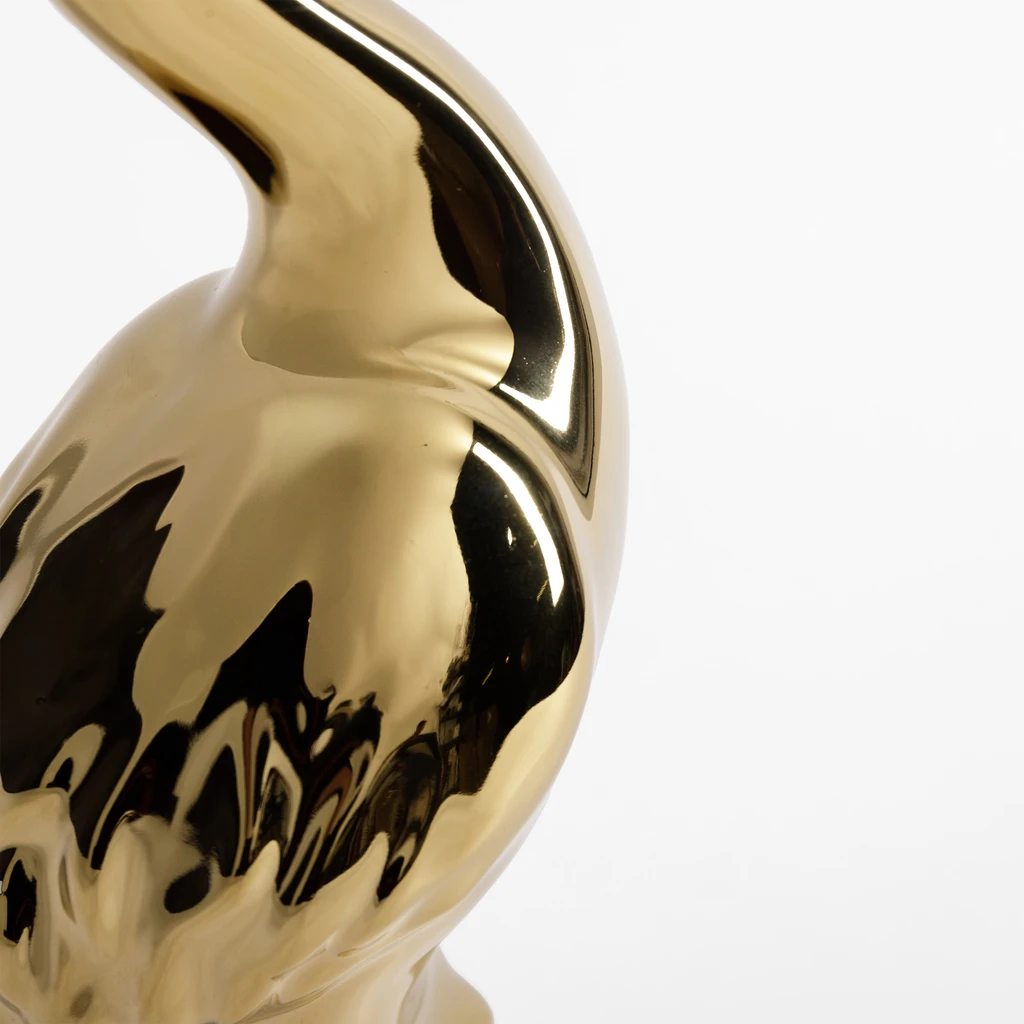 Złota figurka w kształcie żurawia