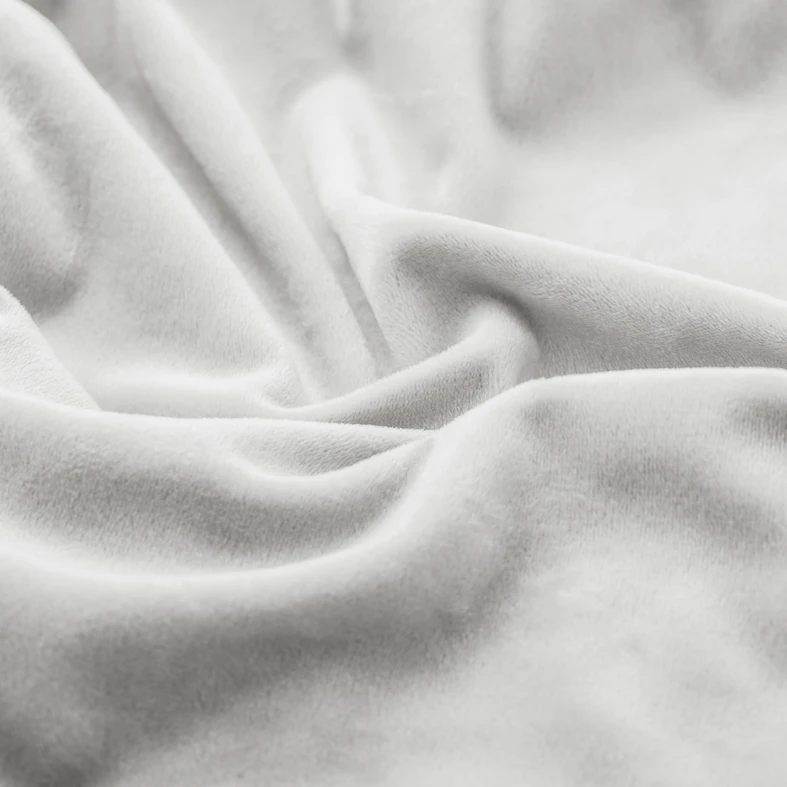 Zdjęcie pokrowca. Duże zbliżenie. Widać marszczenia i fakturę materiału.