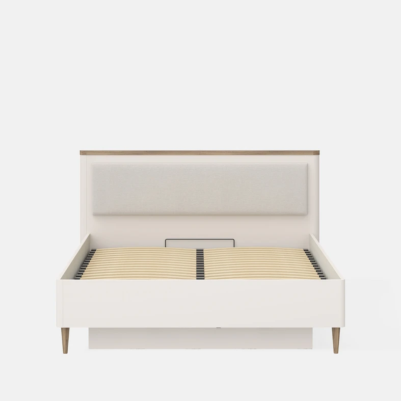 Beżowe łóżko z elementami w kolorze ciepłego drewna, z tapicerowanym panelem na wezgłowiu