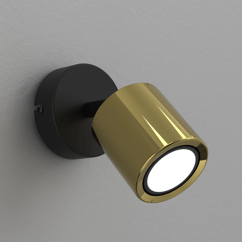 Posiada design oparty na geometrycznych bryłach oraz oprawę żarówki w kształcie walca.