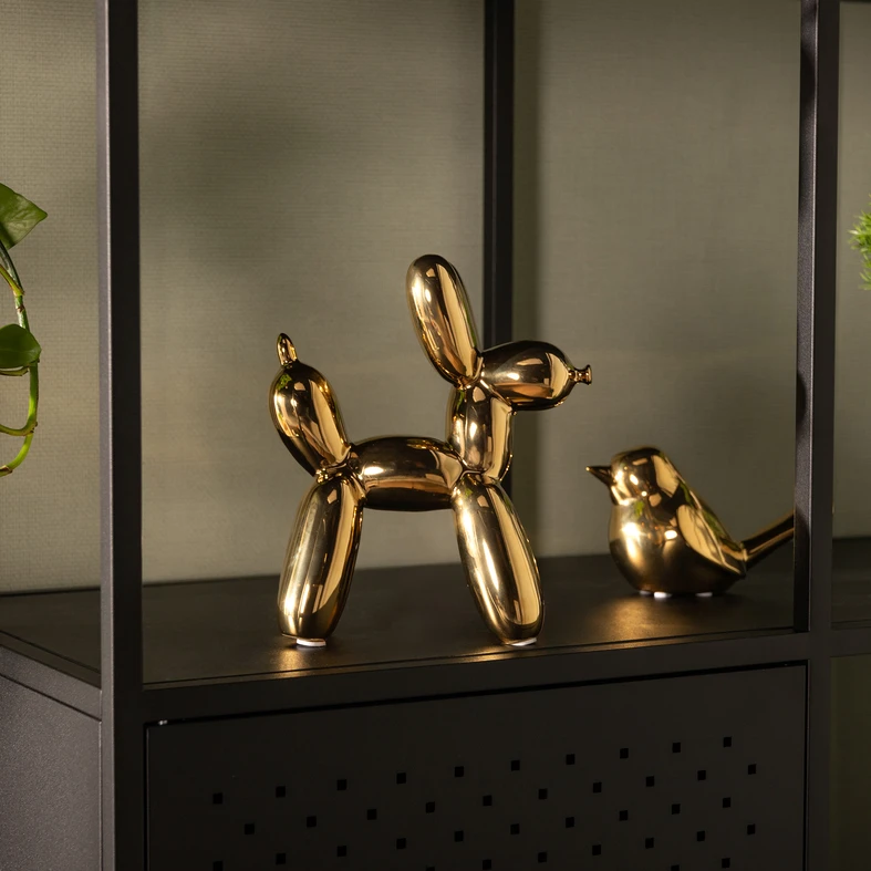 Złota figurka w kształcie ptaka z kamionki