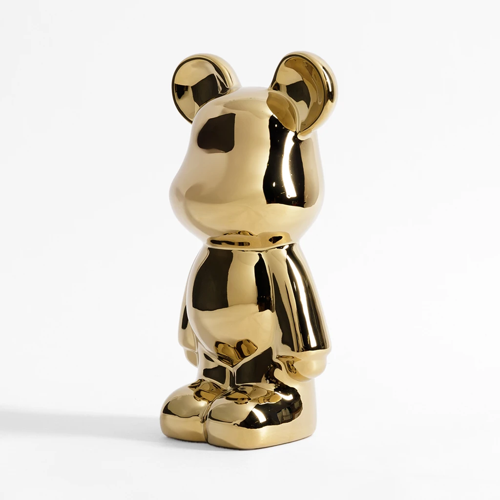 Złota figurka w kształcie misia