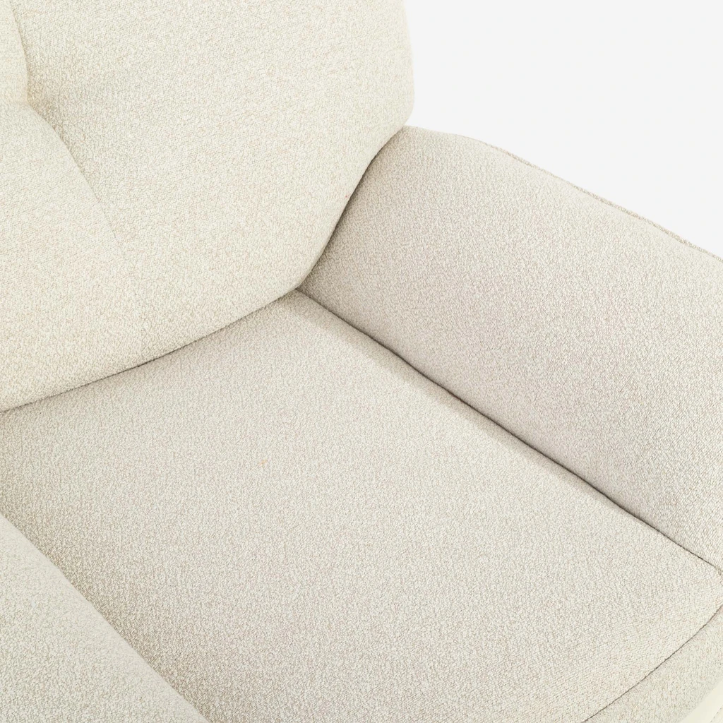 Zdjęcie fotela. Zbliżenie na detale. Widać fakturę materiału. 